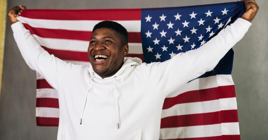 A black person in USA with USA flag