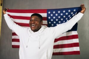 A black person in USA with USA flag